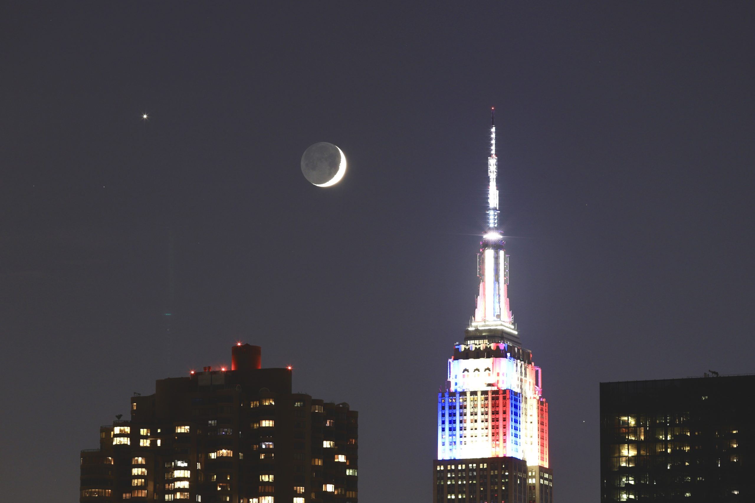 Crescent Moon Venus Regulus Conjunction over Empire State Building by John Bills